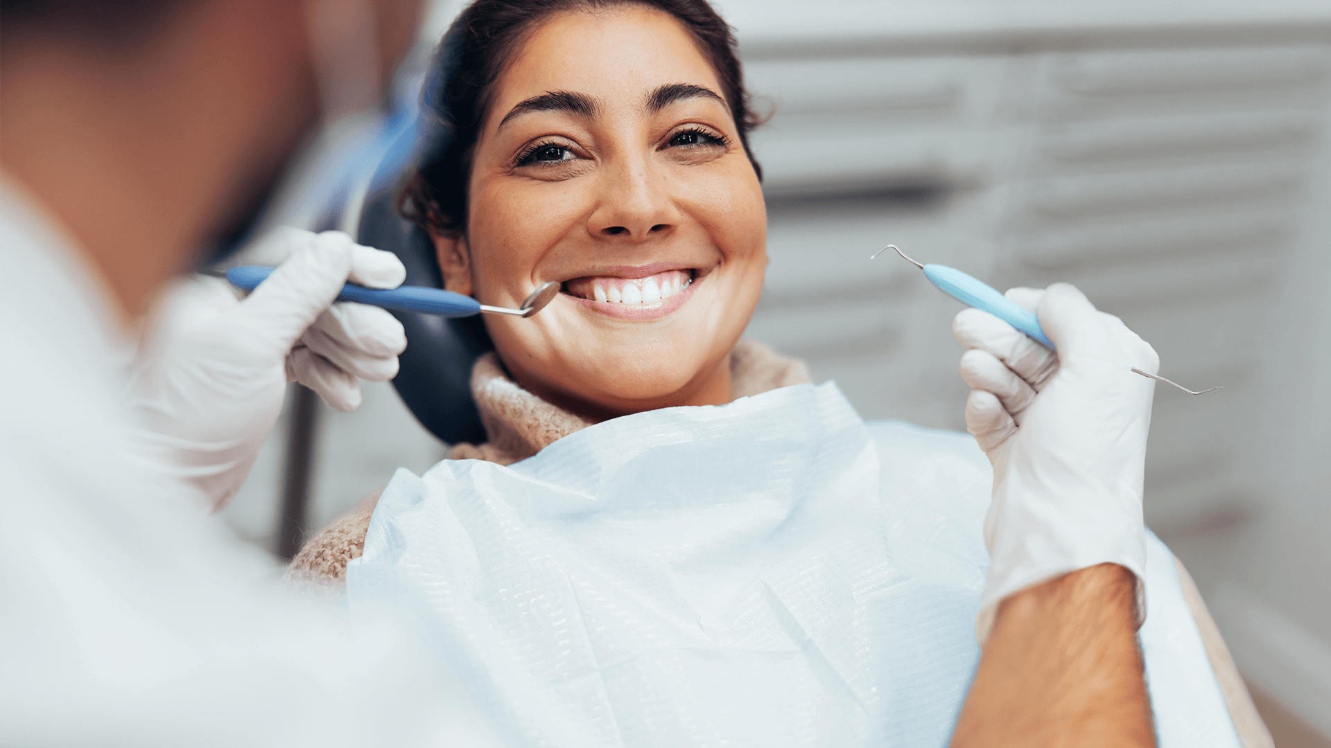 Dentist attending to patient.